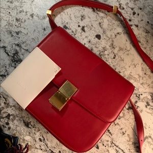 Medium sized red Céline box purse.